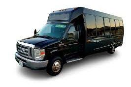 Black shuttle bus with a large tinted window and a step entrance.