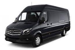 Black Mercedes-Benz Sprinter van with sliding side door and large cargo space.